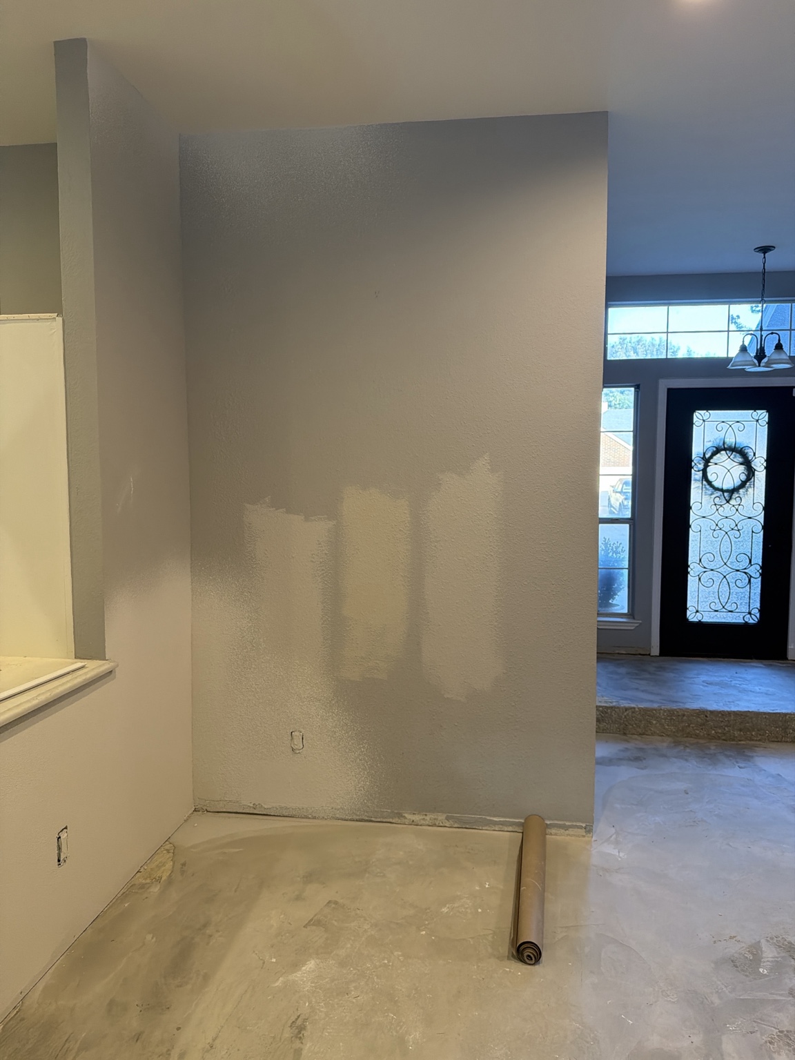 Stepped interior wall with patch and paint samples